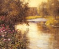 Flores de primavera a lo largo de un río serpenteante Louis Aston Knight